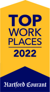 A yellow pentagon award graphic with text  "TOP WORK PLACES 2022" in blue and a blue triangle at the bottom with text "Hartford Courant" in white