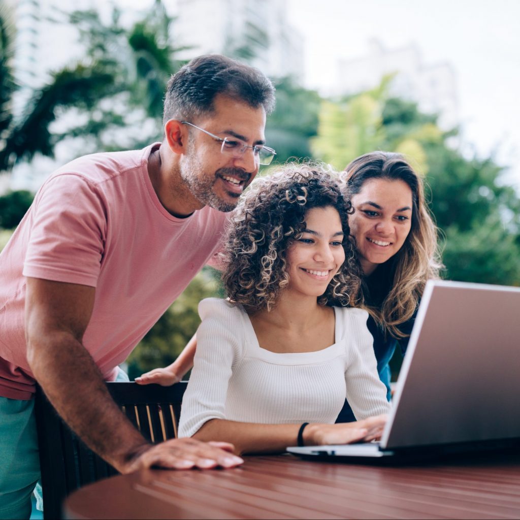 Family using laptop taking a financial personality test