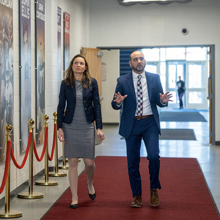 Felix and Alexis walking down the hallway at the New London Community Rec Center